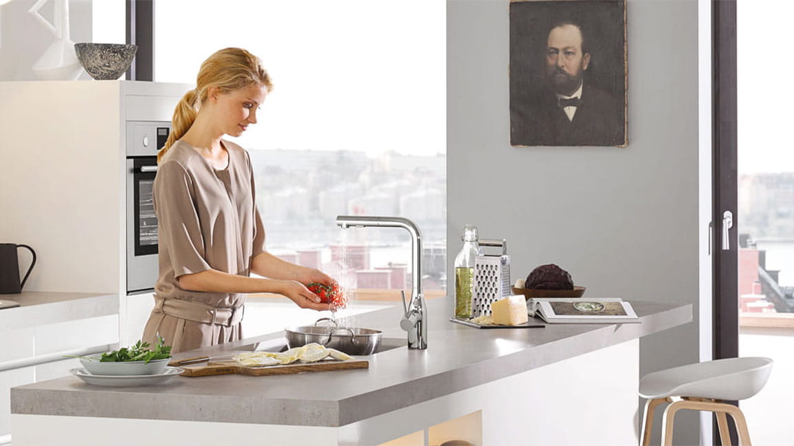 Essence Kitchen Faucet with woman washing produce